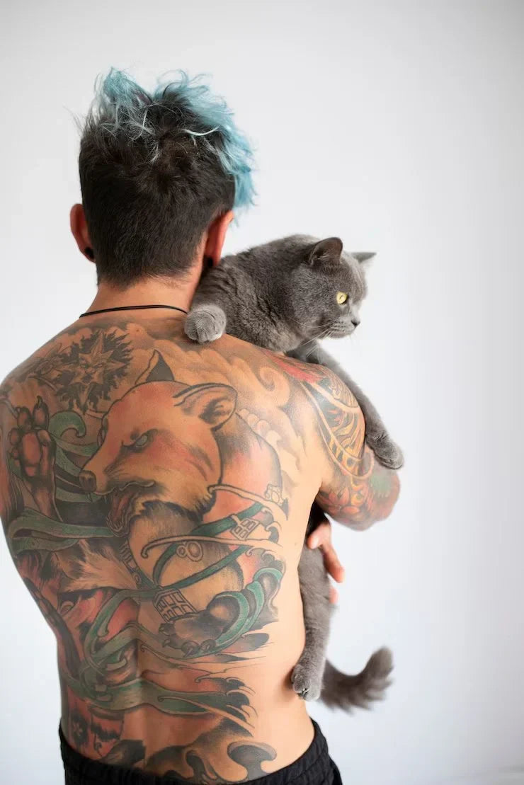 1 back-view-man-being-affectionate-with-cat